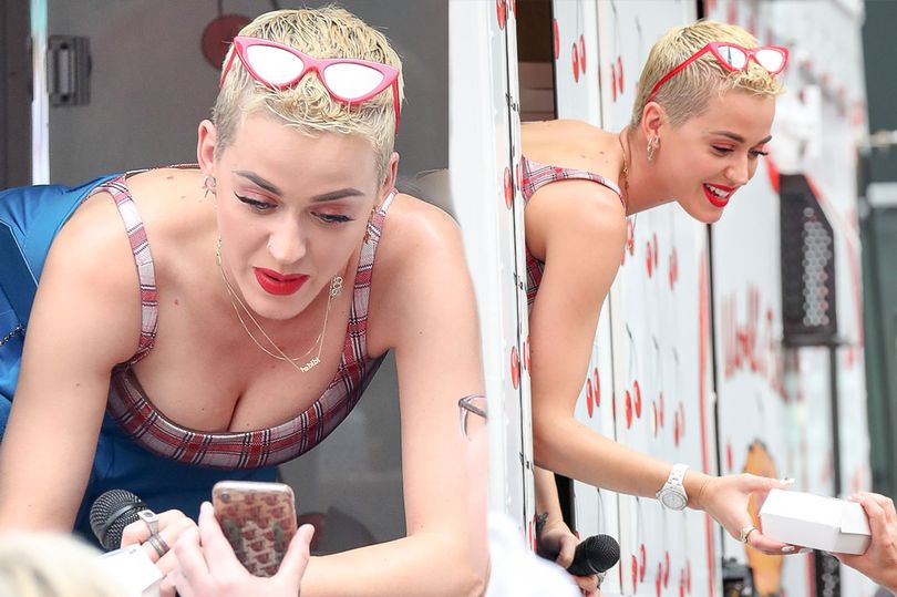 Katy Perry surprises fans in Times Square as she hands out cherry pies to promote new single