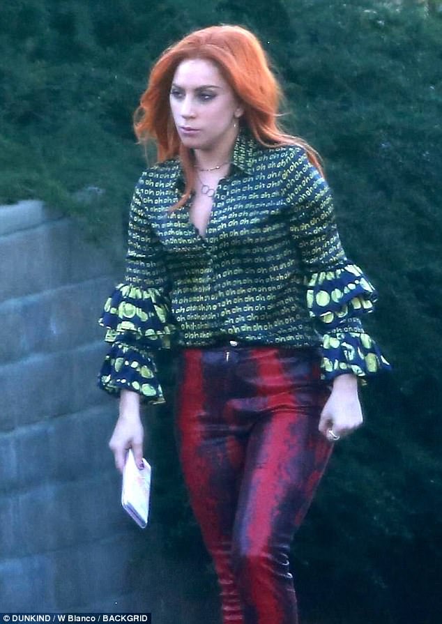 Lady Gaga rocks orange wig and ruffled neon ‘Oh’ blouse on A Star is Born set with Bradley Cooper