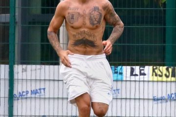 Pecs appeal! Justin Bieber shows off his sculpted torso as he kicks soccer ball around in France