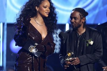 Braless Rihanna shows her edgy side as she wears trenchcoat to accept Grammy with Kendrick Lamar after skipping red carpet