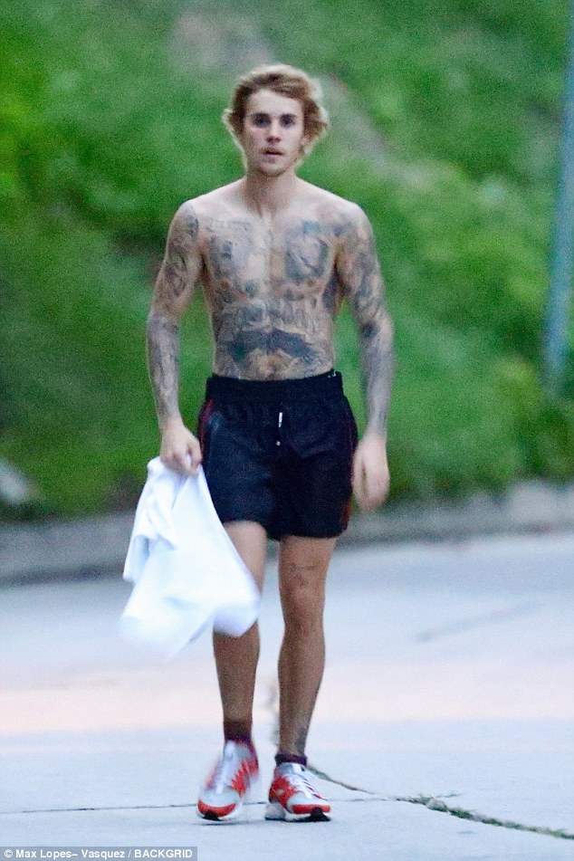 Hot to trot! Shirtless Justin Bieber shows off his lean frame on a solo hike in the Hollywood hills… as he keeps active after split from Selena Gomez